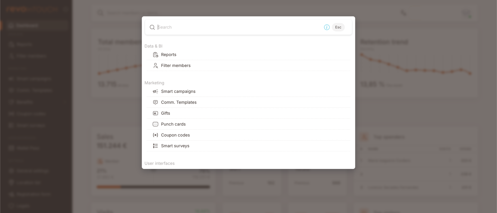 La superposición de la paleta de navegación rápida. El encabezado dice "Search" con un atajo Esc. Debajo: sección Data &amp; BI (Reports, Filter members), sección Marketing (Smart campaigns, Comm. Templates, Gifts, Punch cards, Coupon codes, Smart surveys), sección User Interfaces (cortada por debajo del fold).